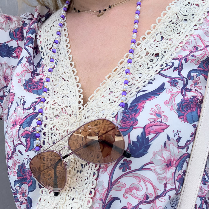 A chain for glasses, beads, an orange pendant