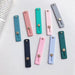 Self-adhesive finger holder with zipper - purple - Cell phone holders<<<HurtelXML